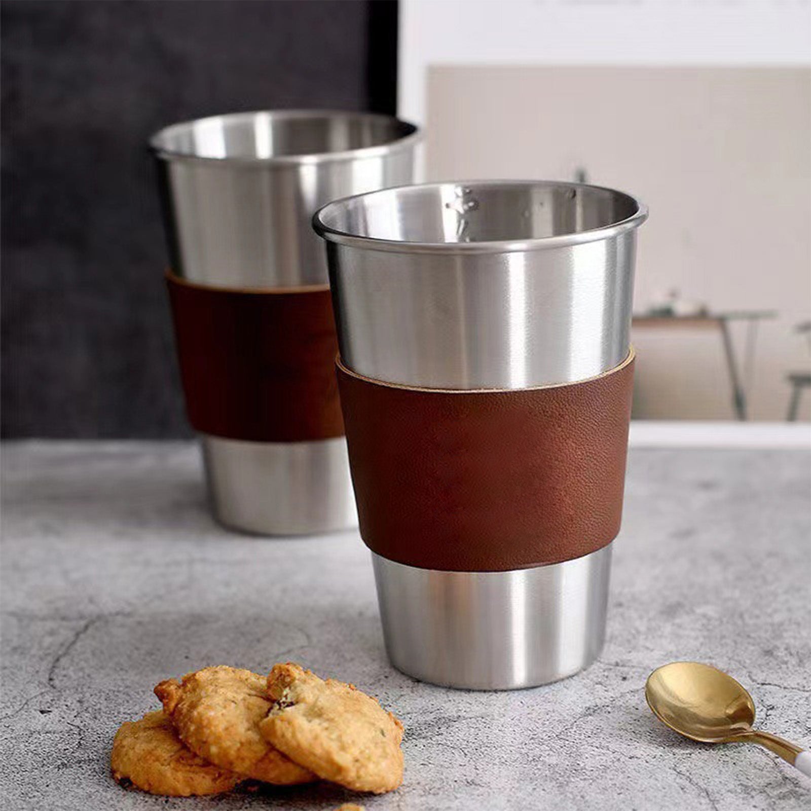 Metal cup with leather holder