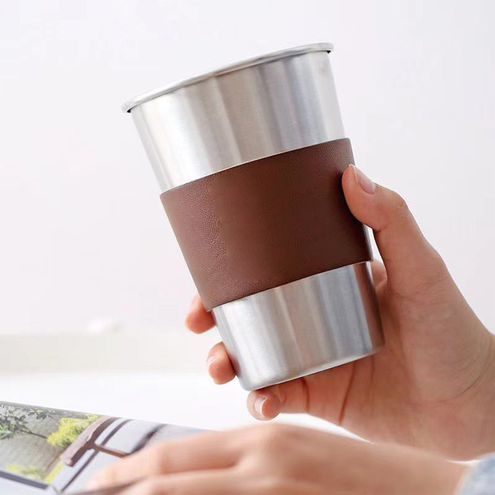 Metal cup with leather holder